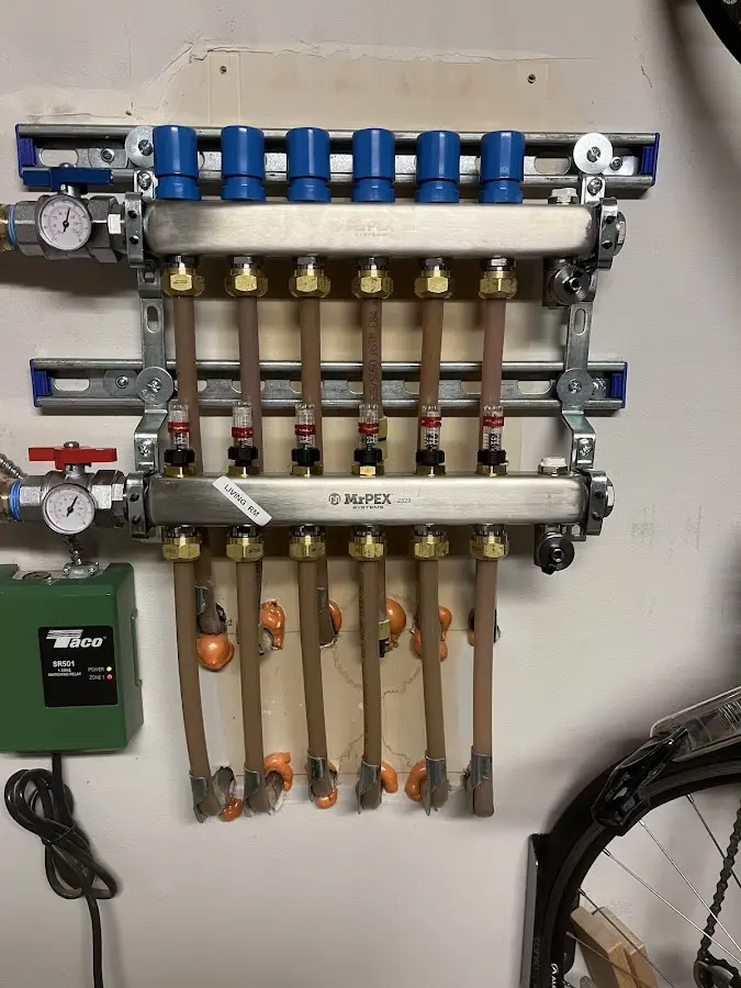 Plumber performing Water Heater Repair at a residential property in Evergreen